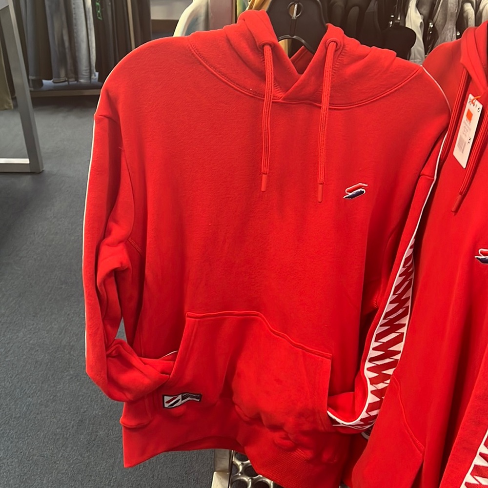RED SUPERDRY HOODIE WHITE PRINT ON THE BACK OF THE ARMS